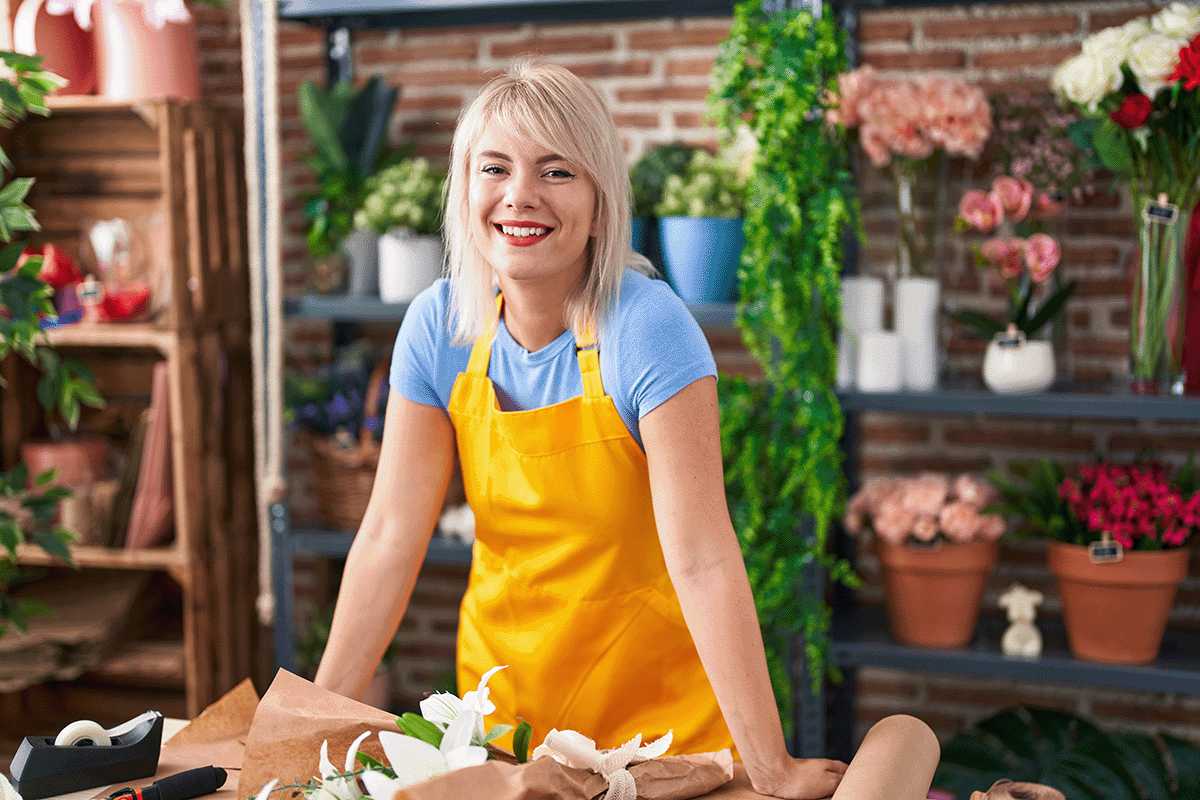 Young lady smiling in a floral shop